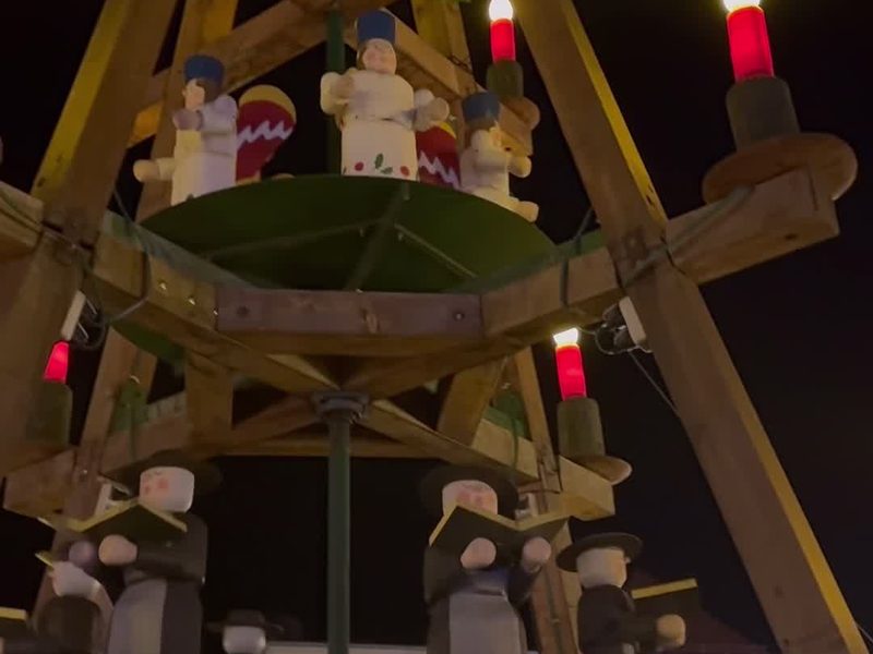 Wooden Christmas pyramid with candles on the market square